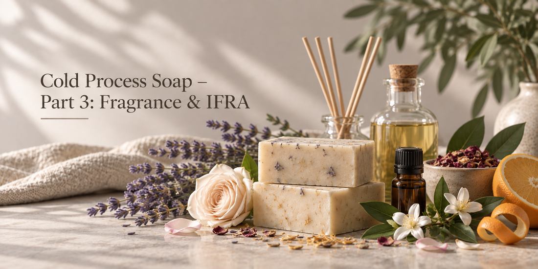 Cold process soap with fragrance bottles, lavender, citrus, rose, and botanicals illustrating fragrance and IFRA in soapmaking.