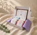 Open Bramble & Bear Signature Collection Ritual Set displaying six signature soaps and one soap tray in a white gift box with lavender tissue, styled on warm ivory linen with eucalyptus and dried flowers.