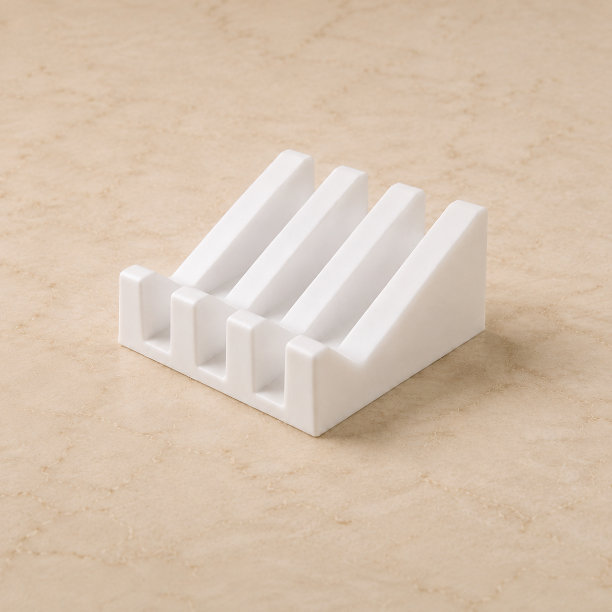 White ridged soap dish shown alone on a warm beige stone countertop with soft natural lighting.