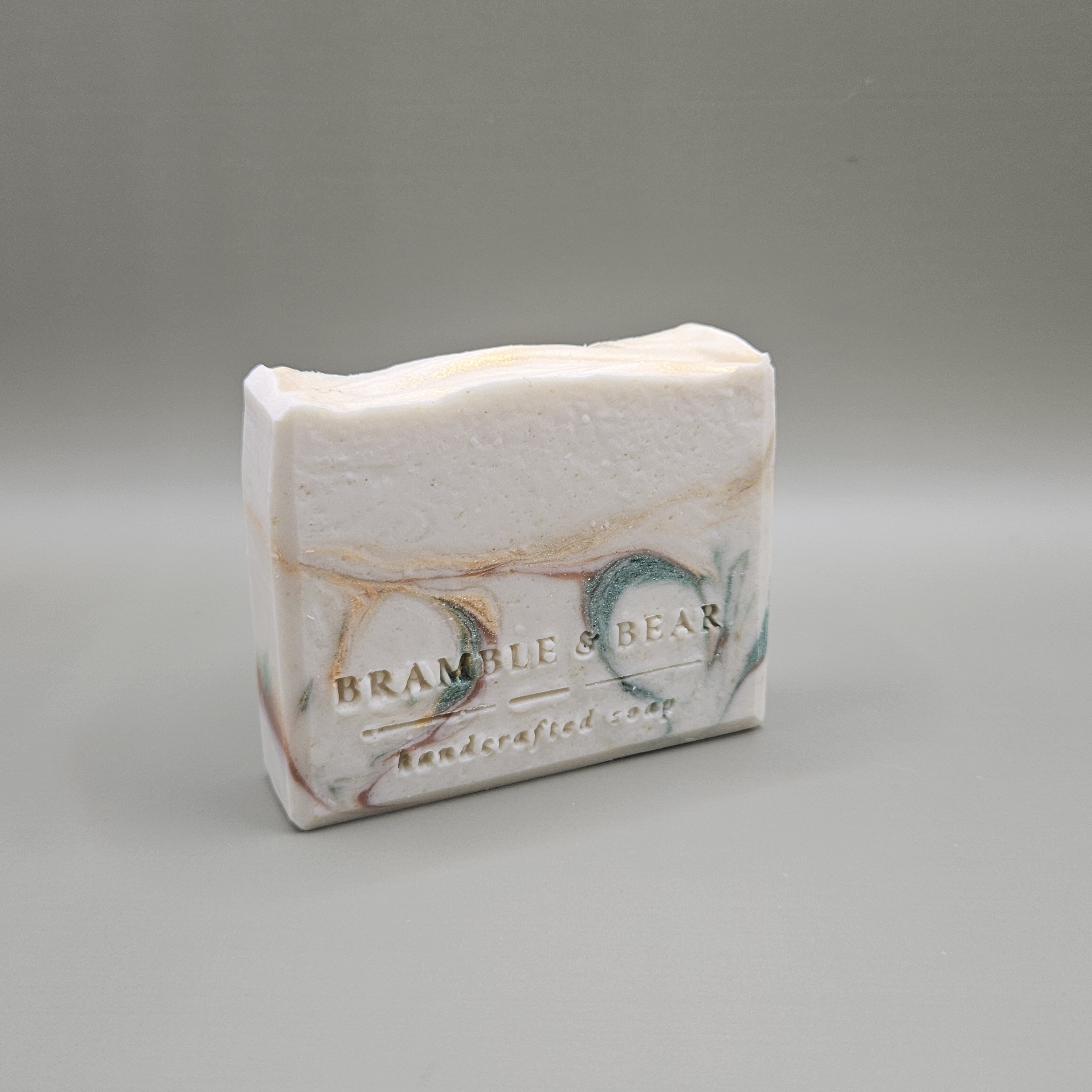 Sunlit Citrus Grove soap bar facing right against a plain gray background.