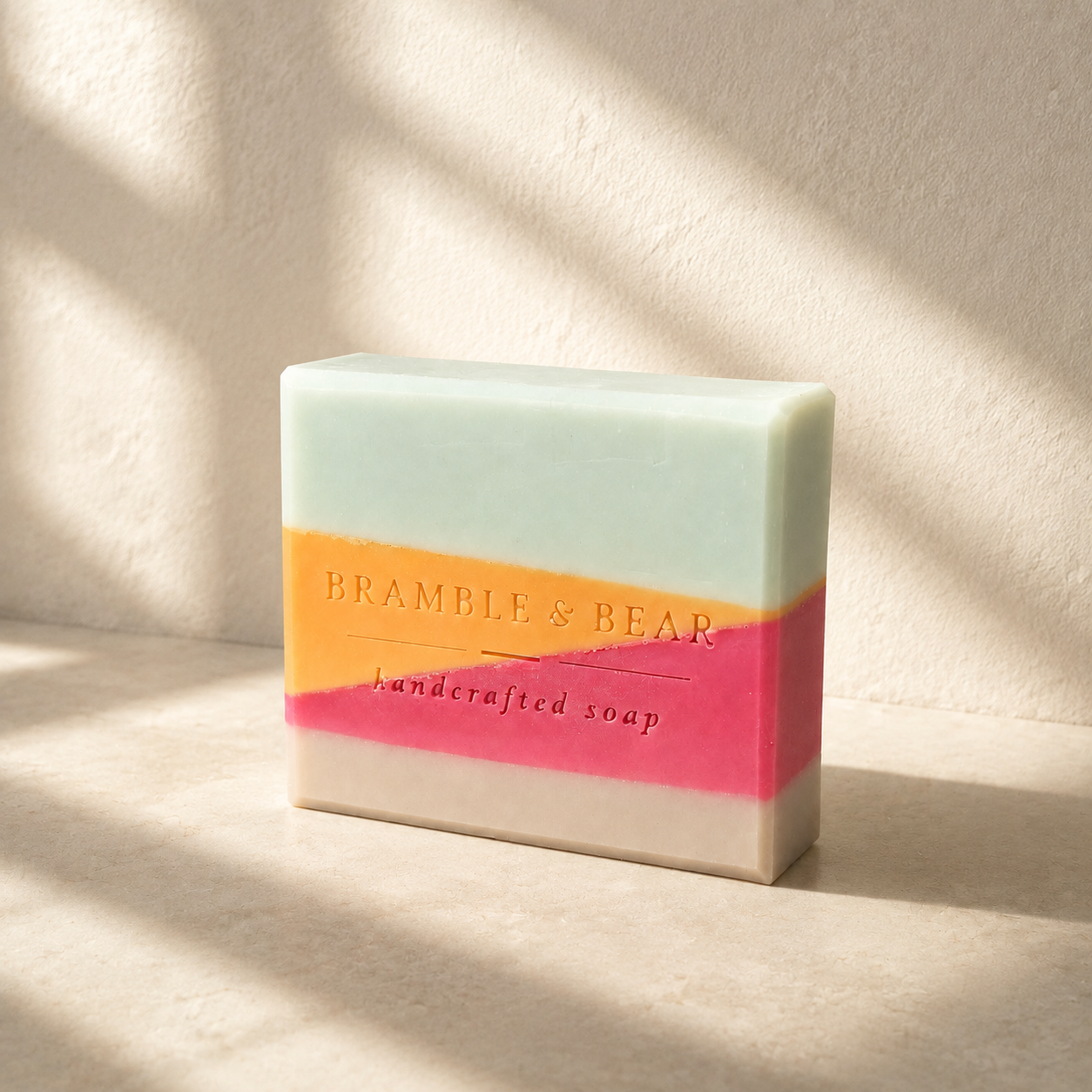 Single Copenhagen Summer soap bar on pale stone with soft architectural window shadows. 