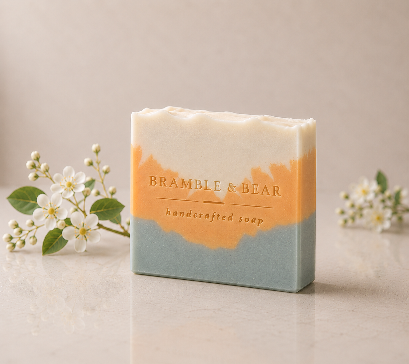 Single Sunlit Citrus Grove soap bar standing upright with ivory, apricot, and sage green layers, styled against a soft citrus blossom background and warm marble surface.