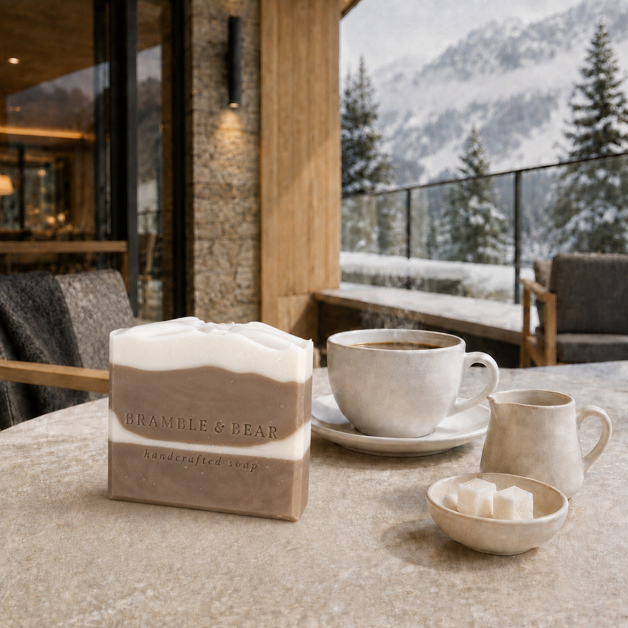 Frosted Gingerbread Cream soap beside coffee and cream on a sunlit alpine terrace overlooking snow-covered pines.