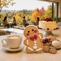 Frosted Pumpkin Apple Cutie soap beside coffee and holiday pastries in a bright café overlooking autumn trees.