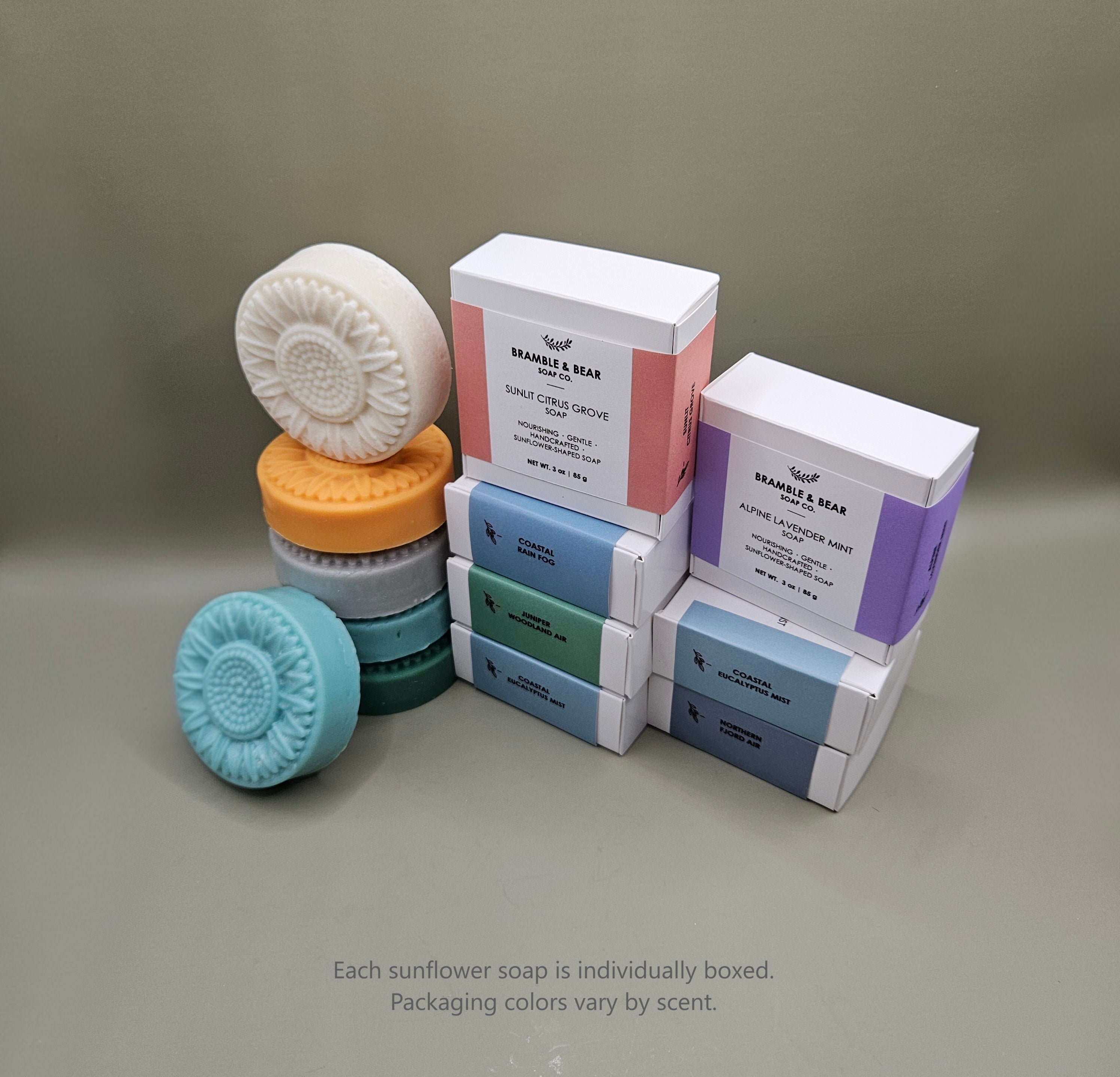 Bramble & Bear sunflower-shaped soaps shown with individual boxed packaging in soft pastel colors.