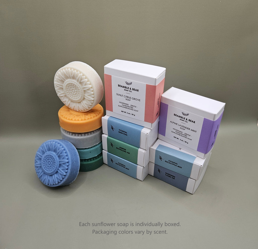 Bramble & Bear sunflower-shaped soaps shown with individual boxed packaging in soft pastel colors.