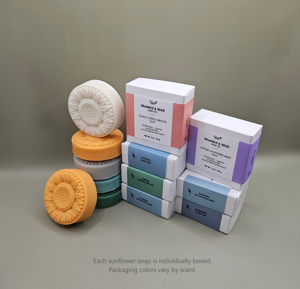 Bramble & Bear sunflower-shaped soaps shown with individual boxed packaging in soft pastel colors.