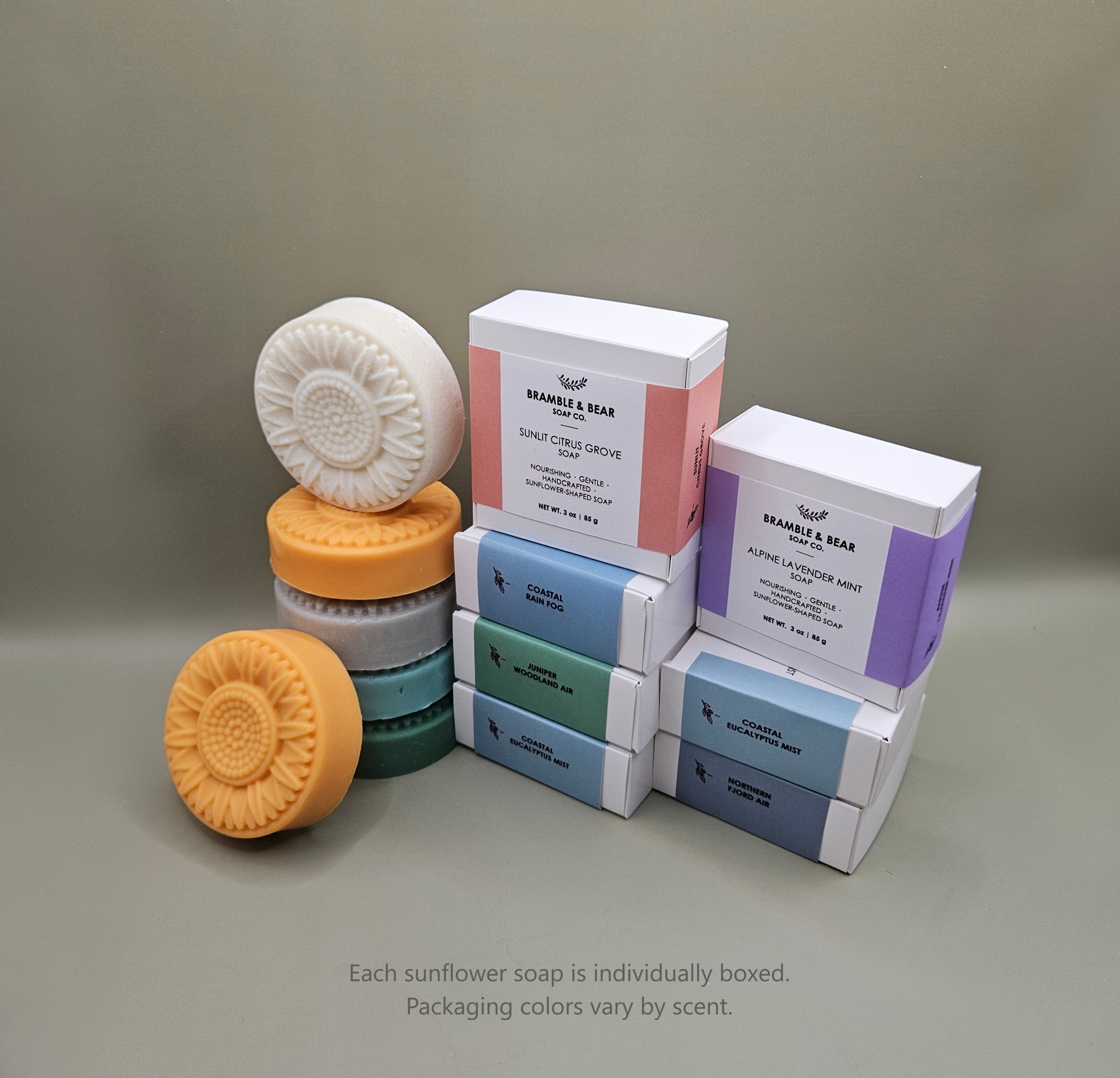 Bramble & Bear sunflower-shaped soaps shown with individual boxed packaging in soft pastel colors.
