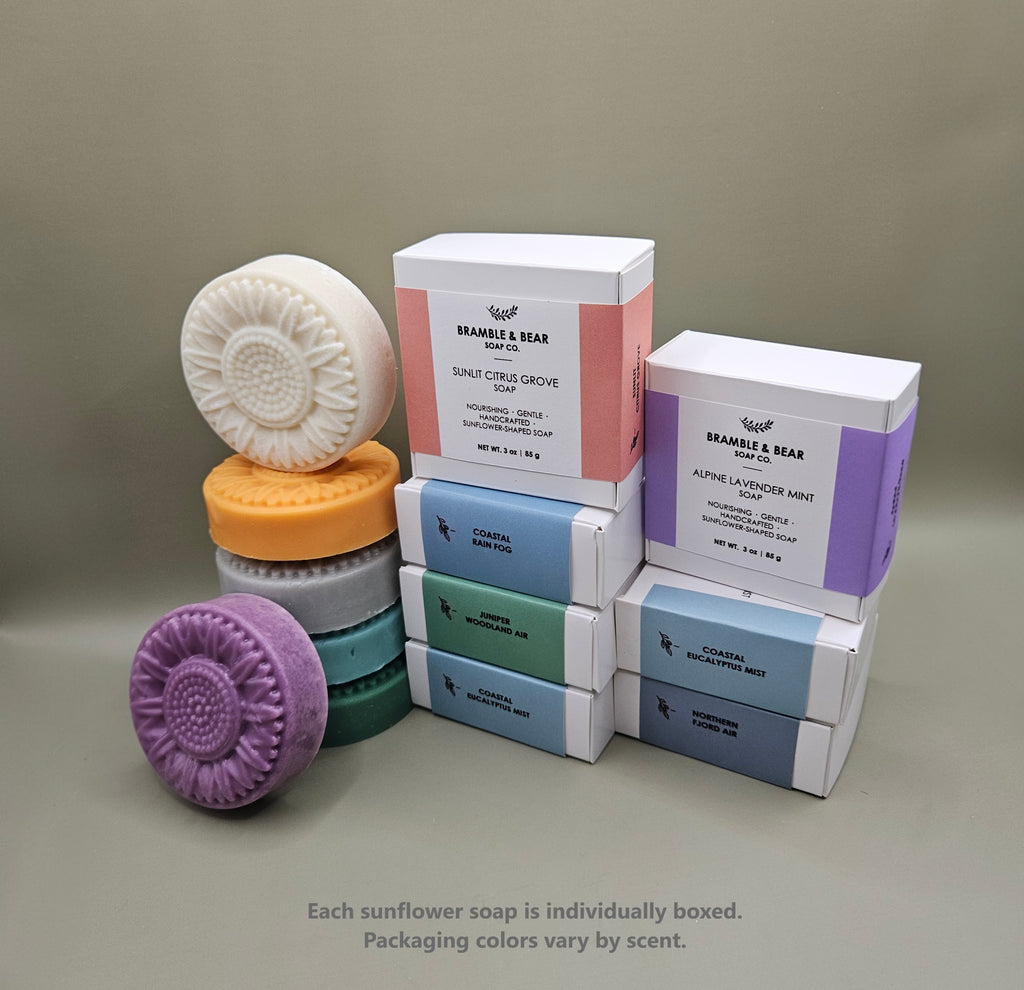 Bramble & Bear sunflower-shaped soaps shown with individual boxed packaging in soft pastel colors.